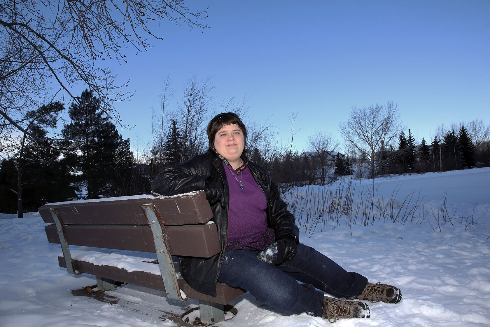 Photo of Jenna Aiken, outdoors, smiling into camera.